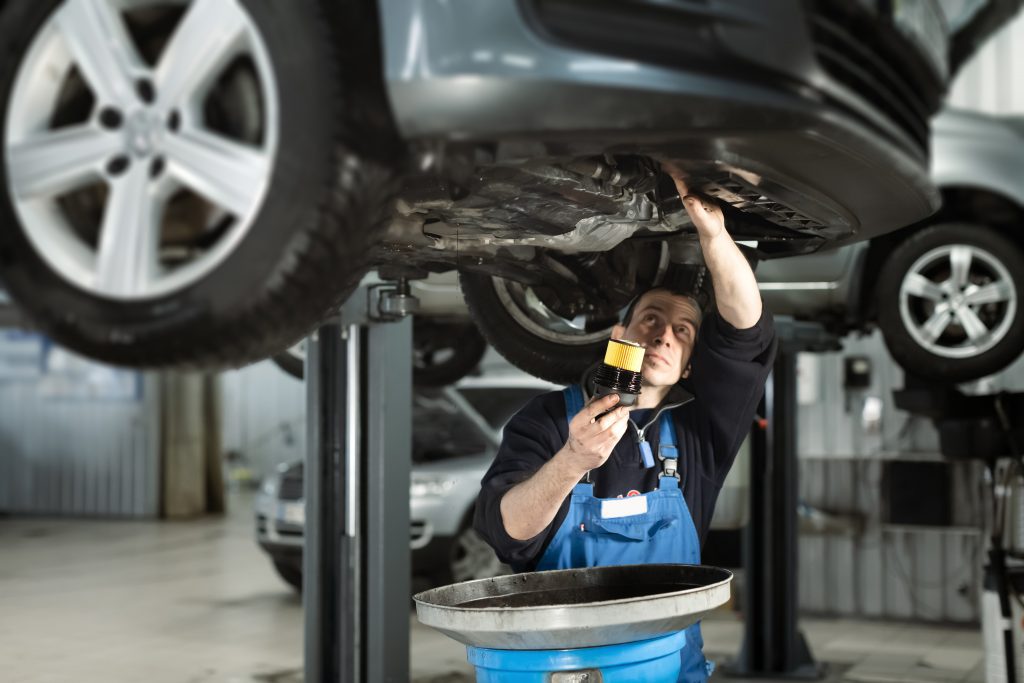 technician performing an oil change